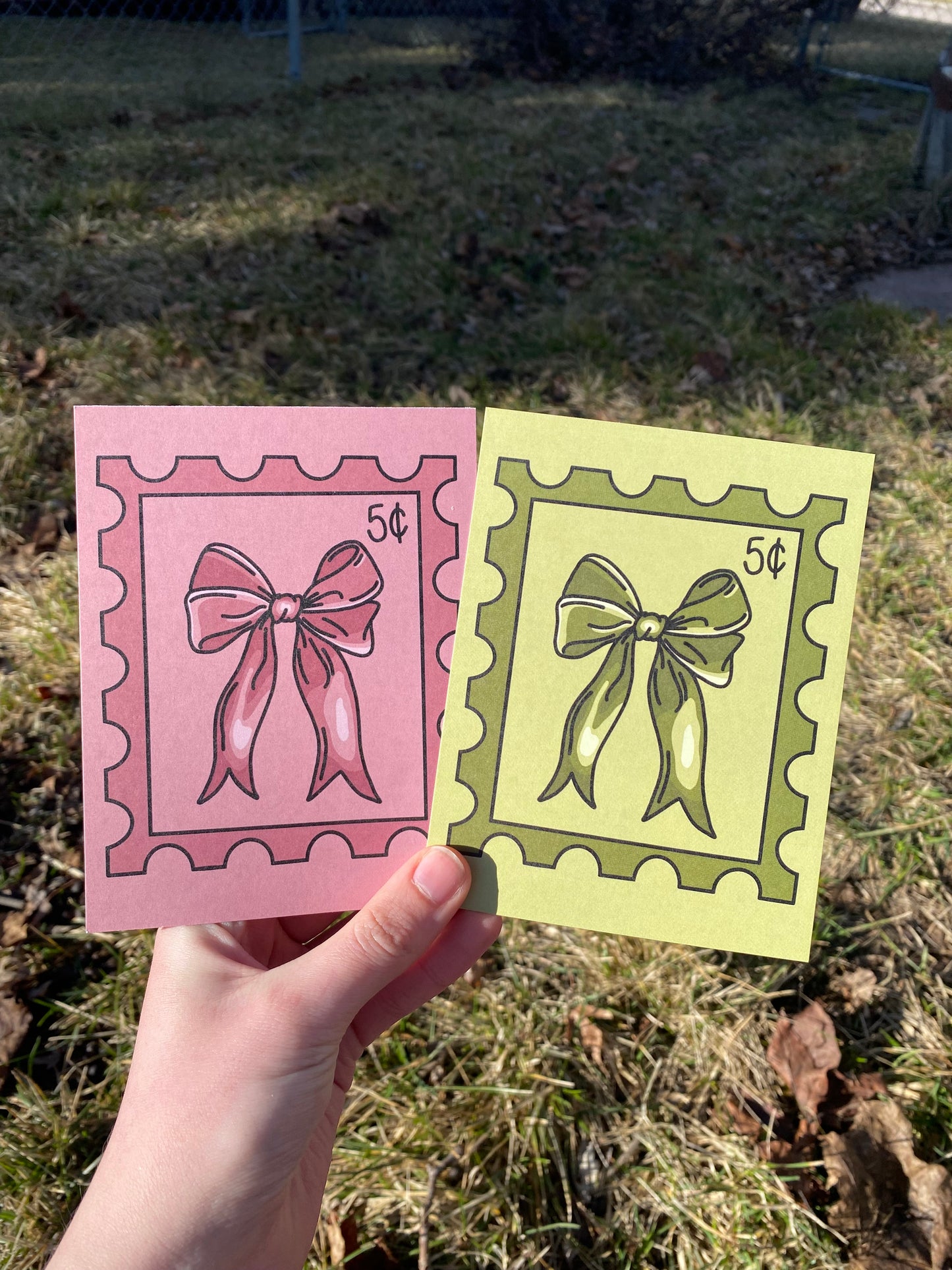Bow Postage Stamp Design Postcard in Pink or Green